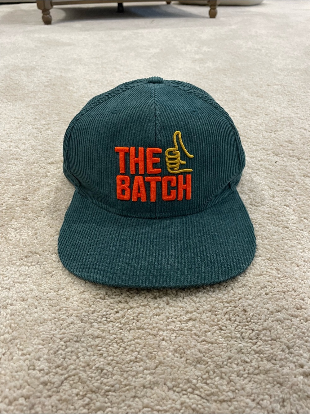 Green Corduroy Cap with Orange Logo and Yellow Accent